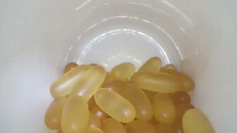 Close-up view inside jar of omega 3 Stock Footage 156704216