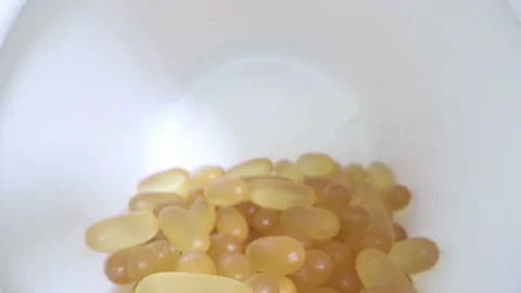 Close-up view inside jar of omega 3 Stock Footage 157083053