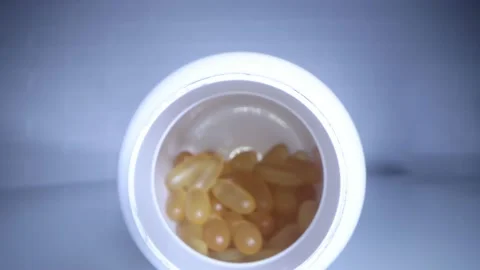 Close-up view inside jar of omega 3 Stock Footage 166107100