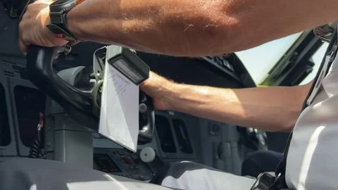 Close up view inside a modern jet cockpit of a pilot checking the flight Stock Footage 248413652