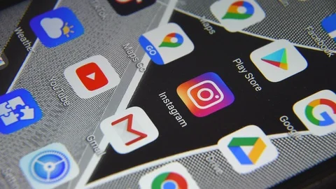 Close-up view of Instagram icon app on an Android smartphone, including other Stock Footage 127710900