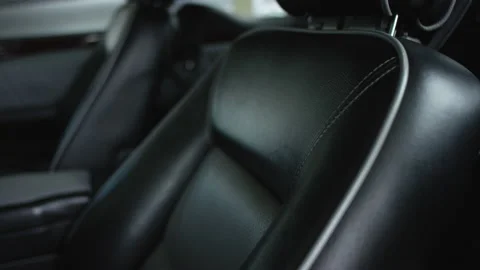 Close-up view in interior leather salon of prestige modern car. Black leather Stock Footage 130286038