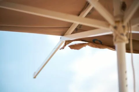 Close-up view of the interior structure and ripped fabric of an old beach u.. Stock Photos