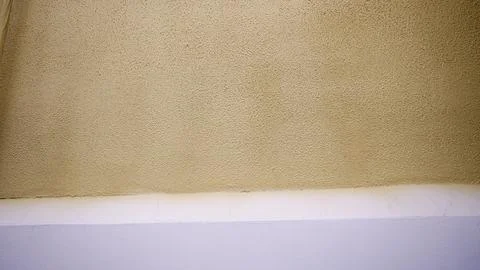 Close up view of interior wall and ceiling junction. Simple geometric composi Stock Photos