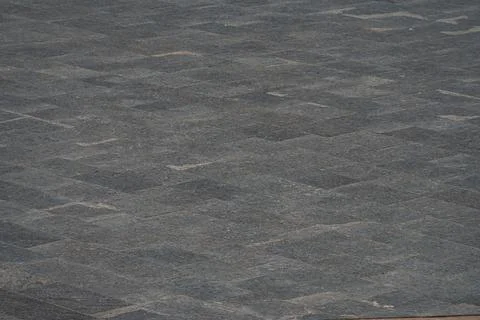 Close-up view of interlocking granite paving stones with subtle texture, on a Stock Photos