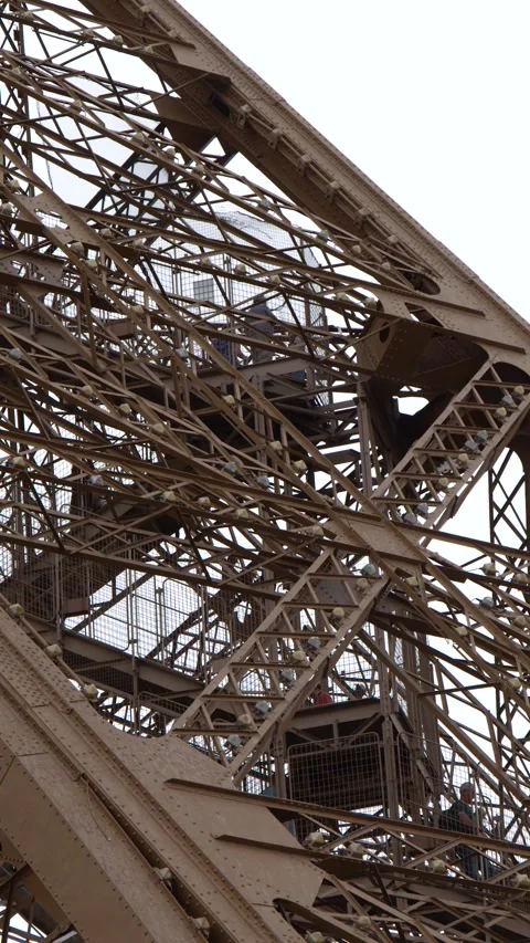 Close Up View of the Intricate Iron Lattice Structure of the Eiffel Tower Stock Footage 334360844