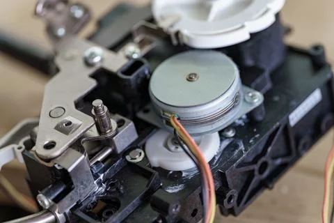 Close-up view of intricate mechanical components inside an electronic devic.. 스톡 사진