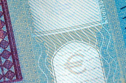 Close-up view of intricate security features on a twenty euro banknote Фото