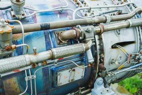 Close view of a jet engine details showing pipes, connections, and componen.. Stock Photos