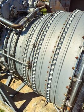 Close view of a jet engine on display at an aerospace museum during a sunny d Stock Photos
