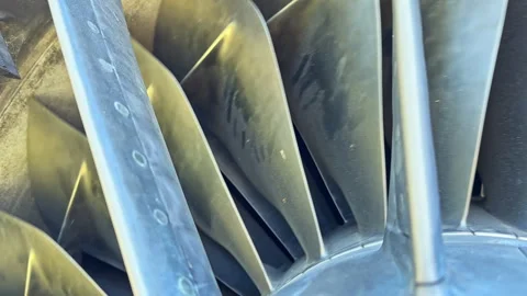 Close view of a jet engine turbine during routine maintenance at an airport Stock Footage 344785102