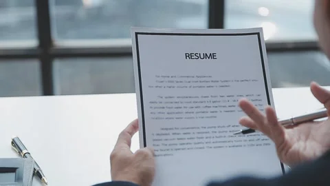 Close up view of job interview in office, focus on resume writing tips, emp.. Stock Footage 237776433