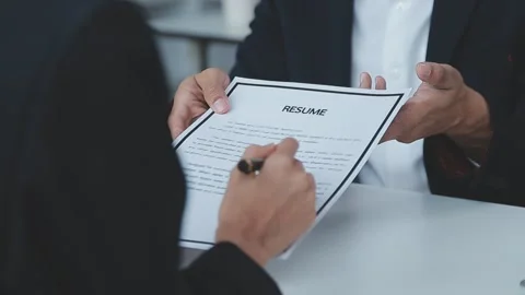 Close up view of job interview in office, focus on resume writing tips, emp.. Stock Footage 237776446