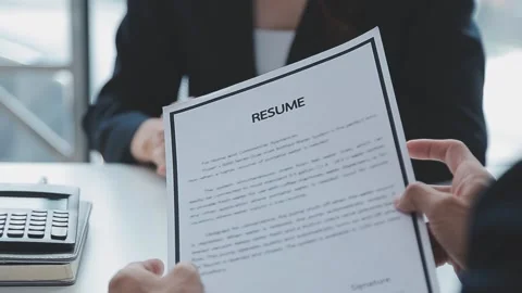 Close up view of job interview in office, focus on resume writing tips, emp.. Stock Footage 237776462