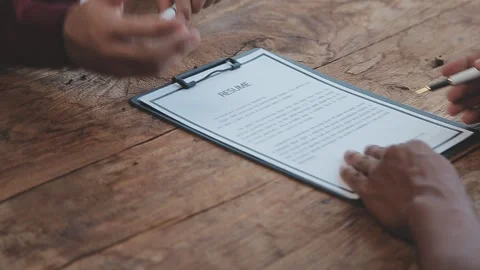 Close up view of job interview in office, focus on resume writing tips, emp.. Video stock 252210821