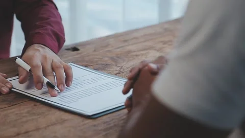 Close up view of job interview in office, focus on resume writing tips, emp.. Stock Footage 252210858