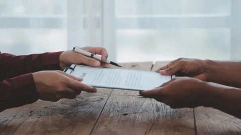 Close up view of job interview in office, focus on resume writing tips, emp.. Stock Footage 252210859