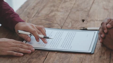 Close up view of job interview in office, focus on resume writing tips, emp.. Stock Footage 252210865