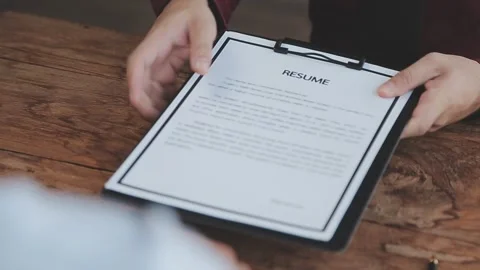 Close up view of job interview in office, focus on resume writing tips, emp.. Stock Footage 252210885