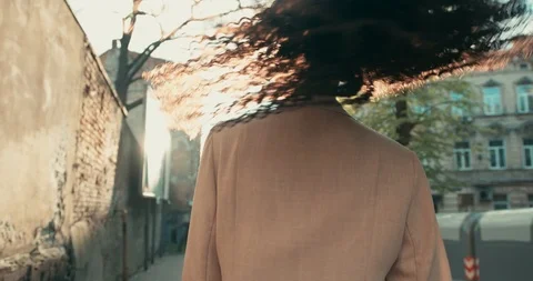 Close-up view of a joyful afro-american lady dressed casually excitedly walking Stock Footage 123215689