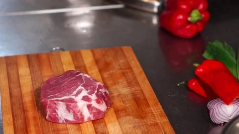 Close up view on juicy thick slice of raw beef steak meat ready for grill on Stock Footage 105457094