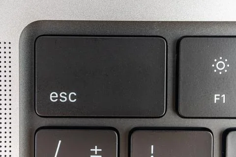 Close-up view of a keyboard corner, with Esc key highlighted Partially visi.. Stock Photos