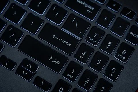Close-up view of a keyboard with focus on keys showing letters and symbols Stock Photos