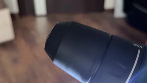 Close-up view of a keyless chuck on a cordless electric drill rotating at high Stock Footage 321700365