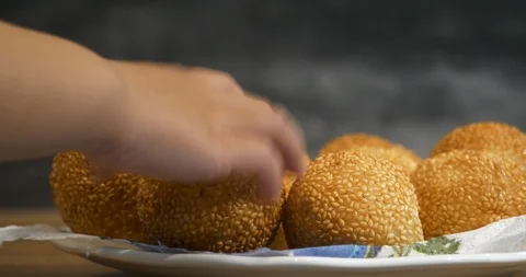 Close view of a kid hand pick up a traditional asian style glutinous rice bal Stock Footage 94453331