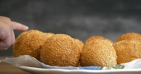 Close view of a kid hand pick up a traditional asian style glutinous rice bal Stock Footage 94453334