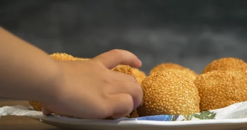 Close view of a kid hand pick up a traditional asian style glutinous rice bal Stock Footage 94453359