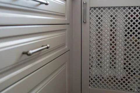 Close-up view of a kitchen cabinet that has a diamond pattern on its doors Stock Photos
