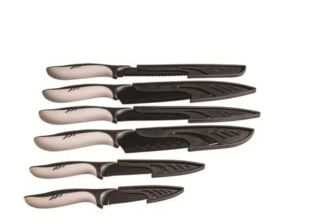 Close-up view of kitchen knives with protective covers isolated Fotos de archivo