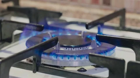 A Close-Up View of a Kitchen Stovetop Burner Stock Footage 279409699