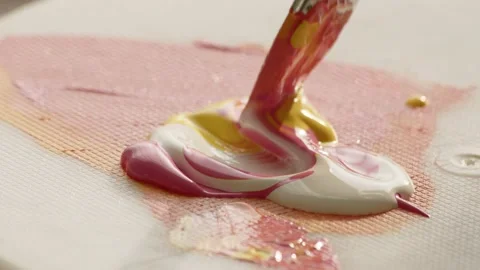 Close up view of kneading paint on palette with wide brush. artist prepares Stock Footage 224605622