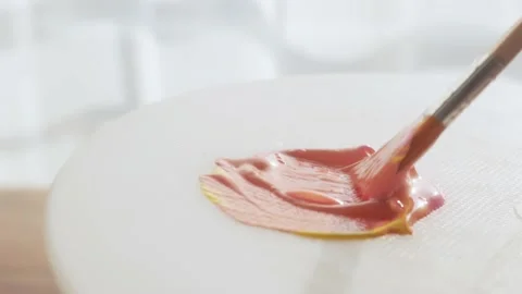 Close up view of kneading paint on palette with wide brush. artist prepares Stock-Footage 226423957