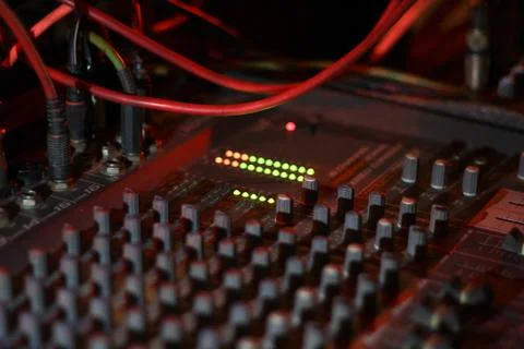 Close up view of knobs and sliders of light and sound board console at a conc Stock Photos