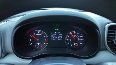 Close up view of a Korean car dashboard while driving at steady speed Stock Footage 330925728