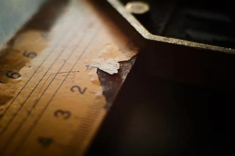 Close up view on L type ruler with label cracking Stock Photos