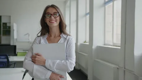Close up view of lady in office in red glasses Stock Footage 157969466