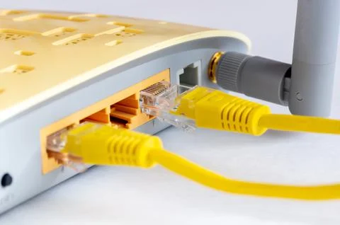Close-up view of LAN network switch connectors with Ethernet cables attached. Foto stock
