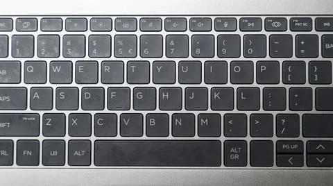 A close-up view of a laptop keyboard showcasing the QWERTY layout. This image is Stock Photos