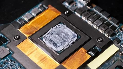 Close-up View of a Laptop Processor with Old Thermal Paste Stock Footage 313860834