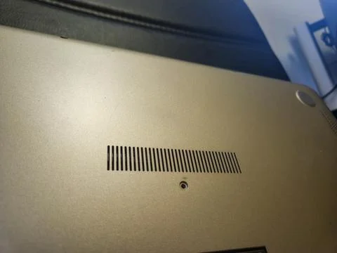 Close-up view of a laptop’s underside revealing intricate ventilation design and Foto stock