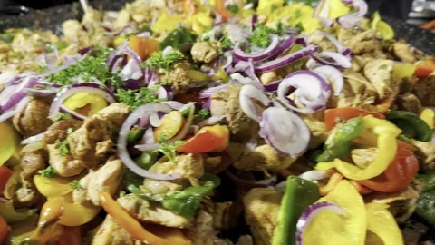 A close-up view of a large pot with meat and vegetables at outdoor snacks Stock Footage 291518277
