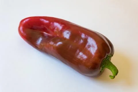 Close view of a large red Capsicum annuum Cubanelle Cuban Italian frying Stock Photos