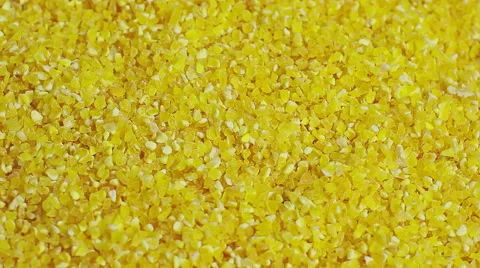 Close view of a layer of stone ground yellow corn meal Video stock 53788895