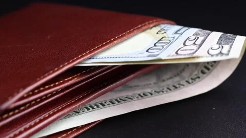 Close up view of leather wallet with American dollar (USD) banknotes. Stock Footage 304250309