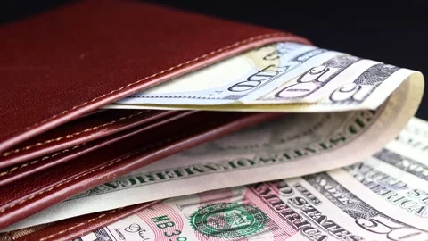 Close up view of leather wallet with American dollar (USD) banknotes. Stock Footage 304250322