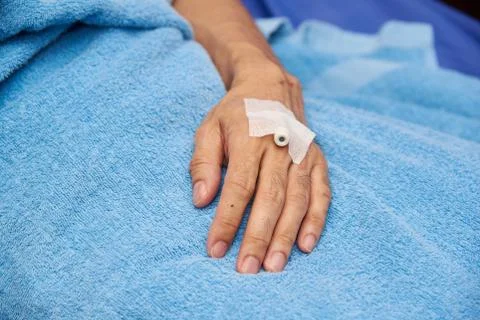 Close-up view of left hand patient with heparin lock Stock Photos